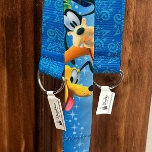 **NEW** Disney Parks Blue and Yellow Character Key Holder